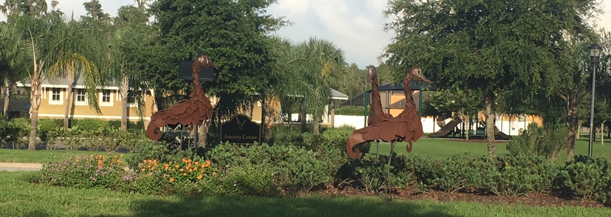 Sculptures in front of Amenity Center Sign
